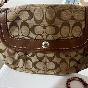 Black and tan coach bag
